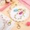 135 Pcs DIY Keychain Making Kit for Women, 4 Pcs Lip Gloss Keychains Cap for Summer Fridays Personalized Mothers Day Gifts Bag Charm Kit with Pink Ornaments Jewelry Accessory